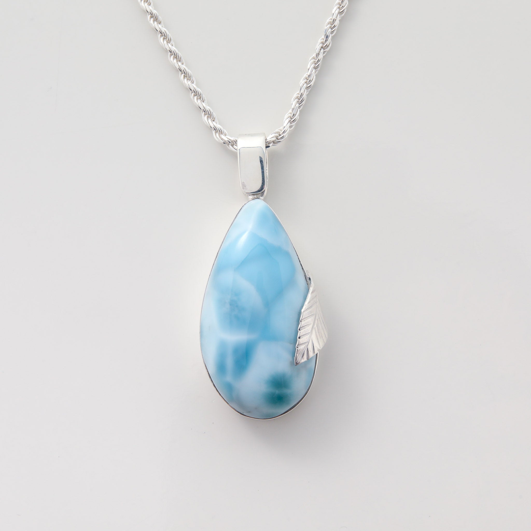 Larimar Pendant Flora complemented by a delicate silver leaf detail