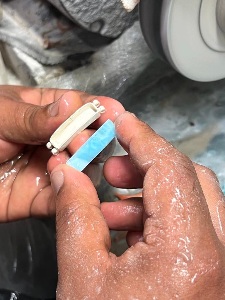 Handcrafting Larimar bracelets for men from The Larimar Shop workshop.