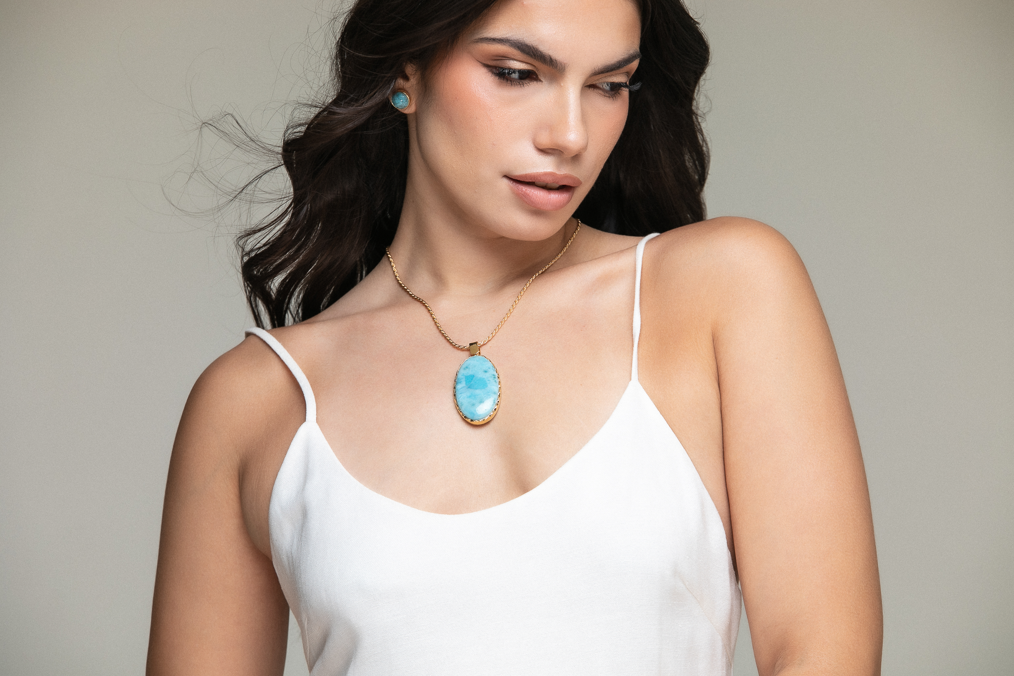 Larimar jewelry crafted in 18k gold vermeil by young artisans at the Dominican Republic.