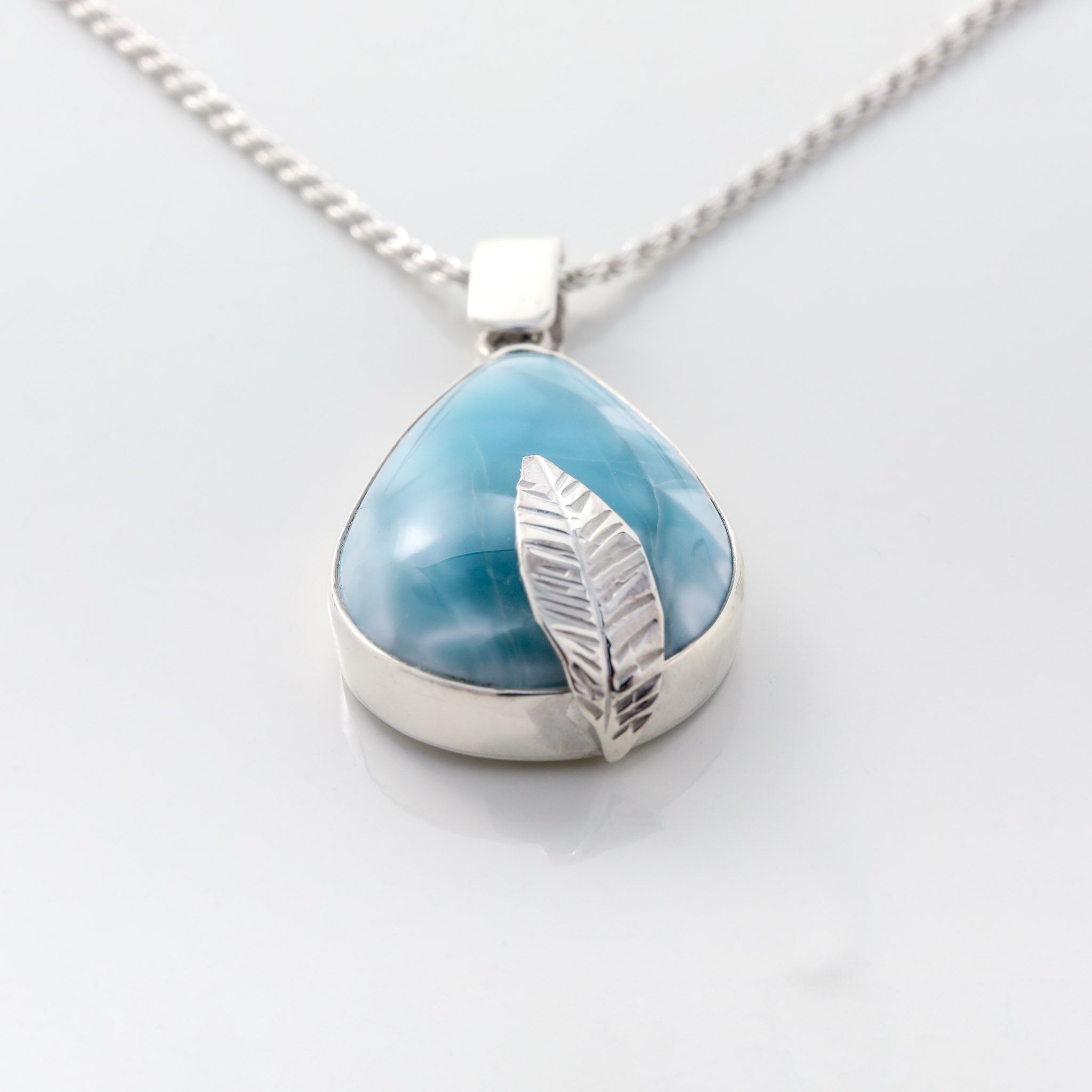 Larimar pendant featuring a silver leaf detail Valora