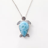 Larimar Pendant Lyric. This unique necklace features a charming turtle pendant made from the mesmerizing Larimar stone.