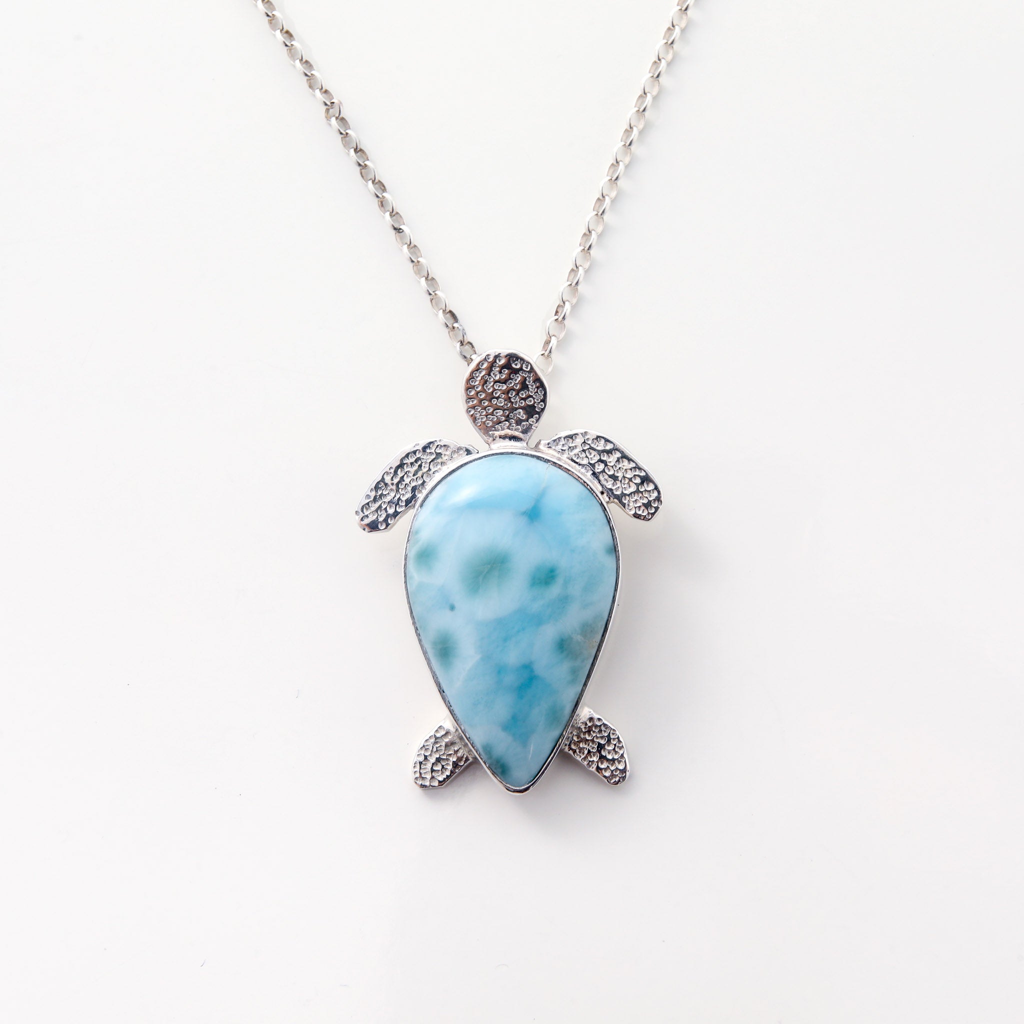 Larimar Pendant Lyric. This unique necklace features a charming turtle pendant made from the mesmerizing Larimar stone.