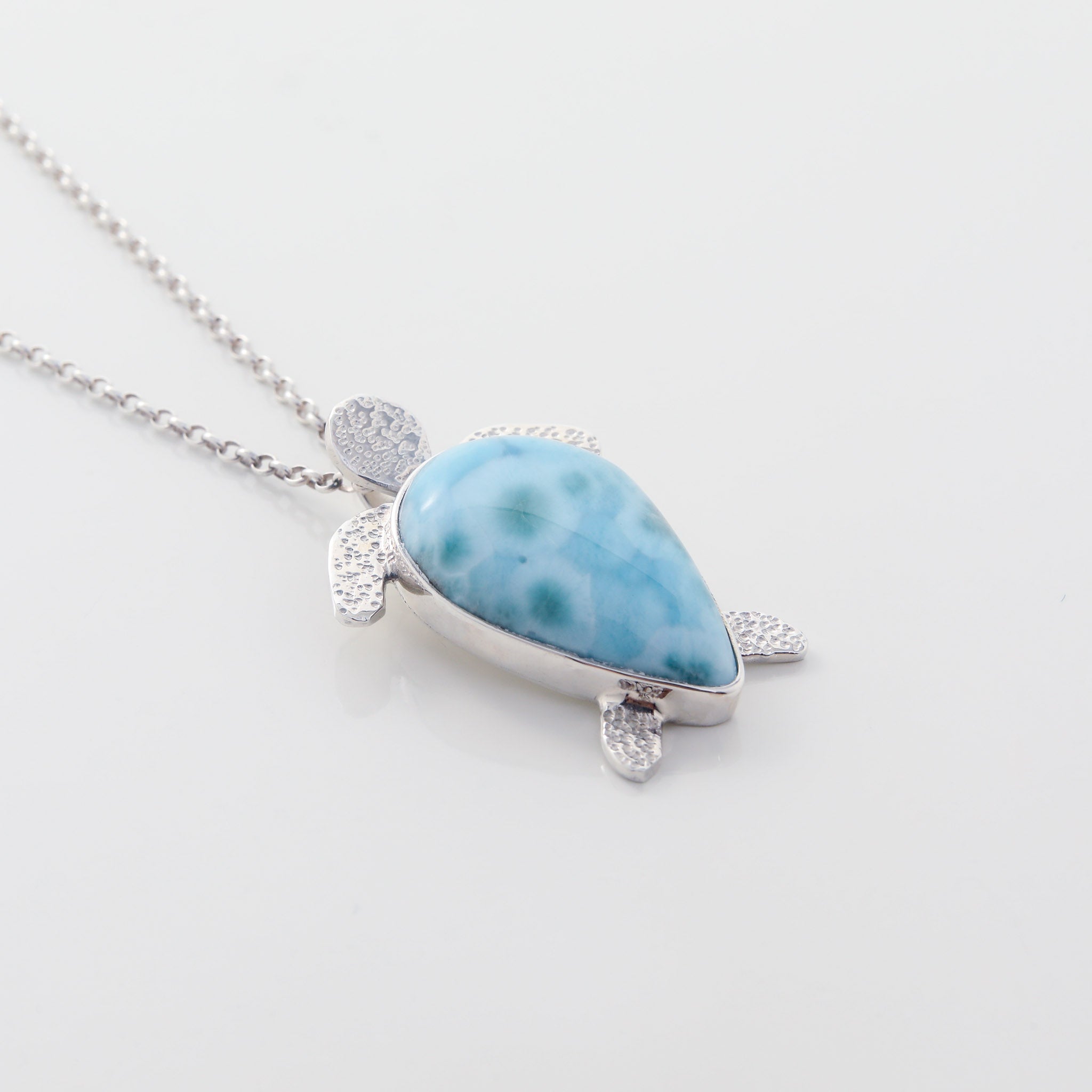 Larimar Pendant Lyric. This unique necklace features a charming turtle pendant made from the mesmerizing Larimar stone.