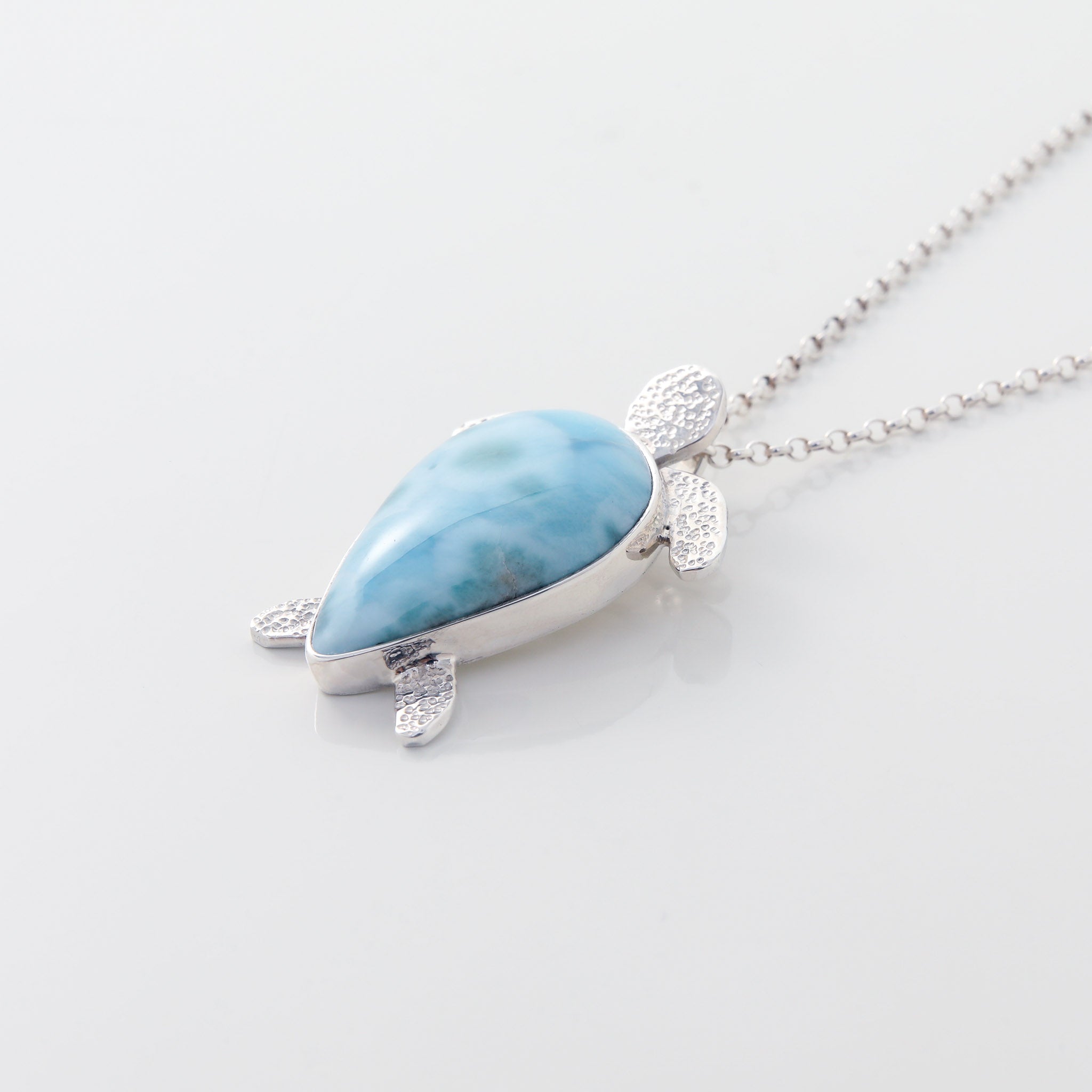 Larimar Pendant Lyric. This unique necklace features a charming turtle pendant made from the mesmerizing Larimar stone.