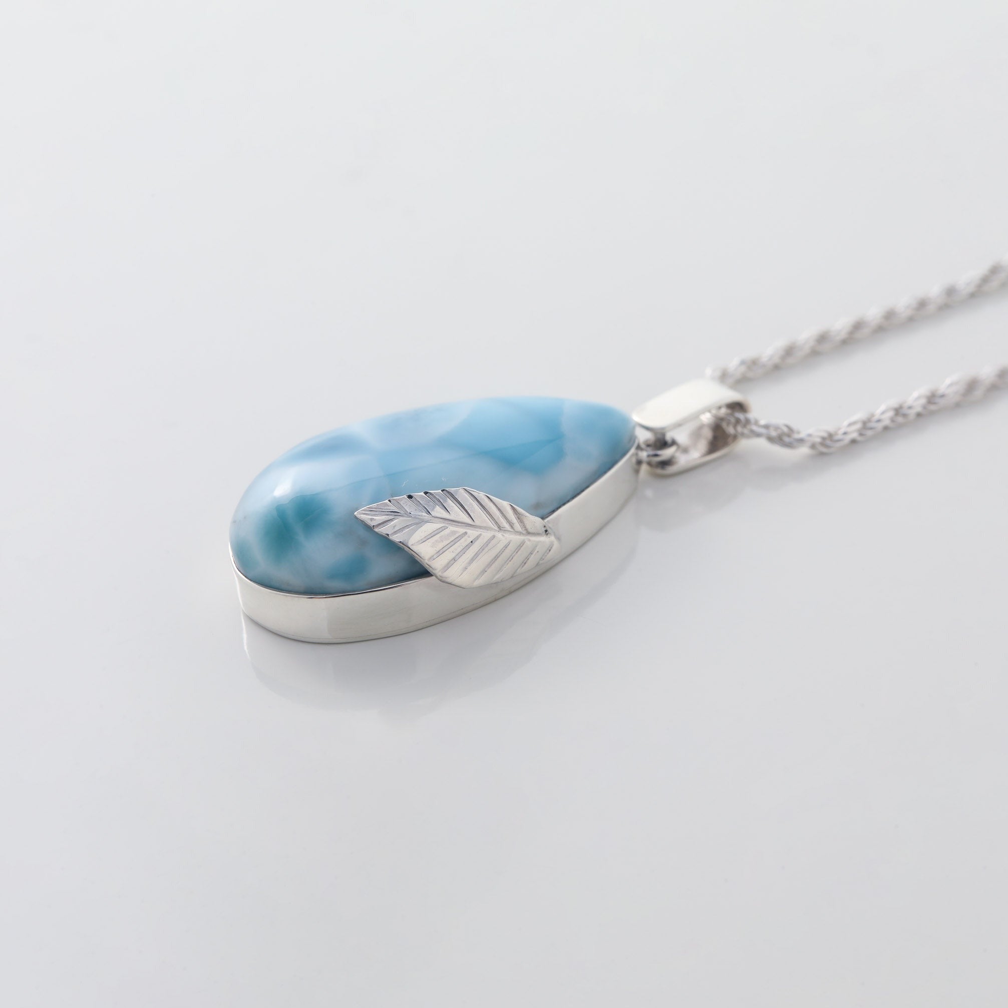 Larimar Pendant Flora complemented by a delicate silver leaf detail