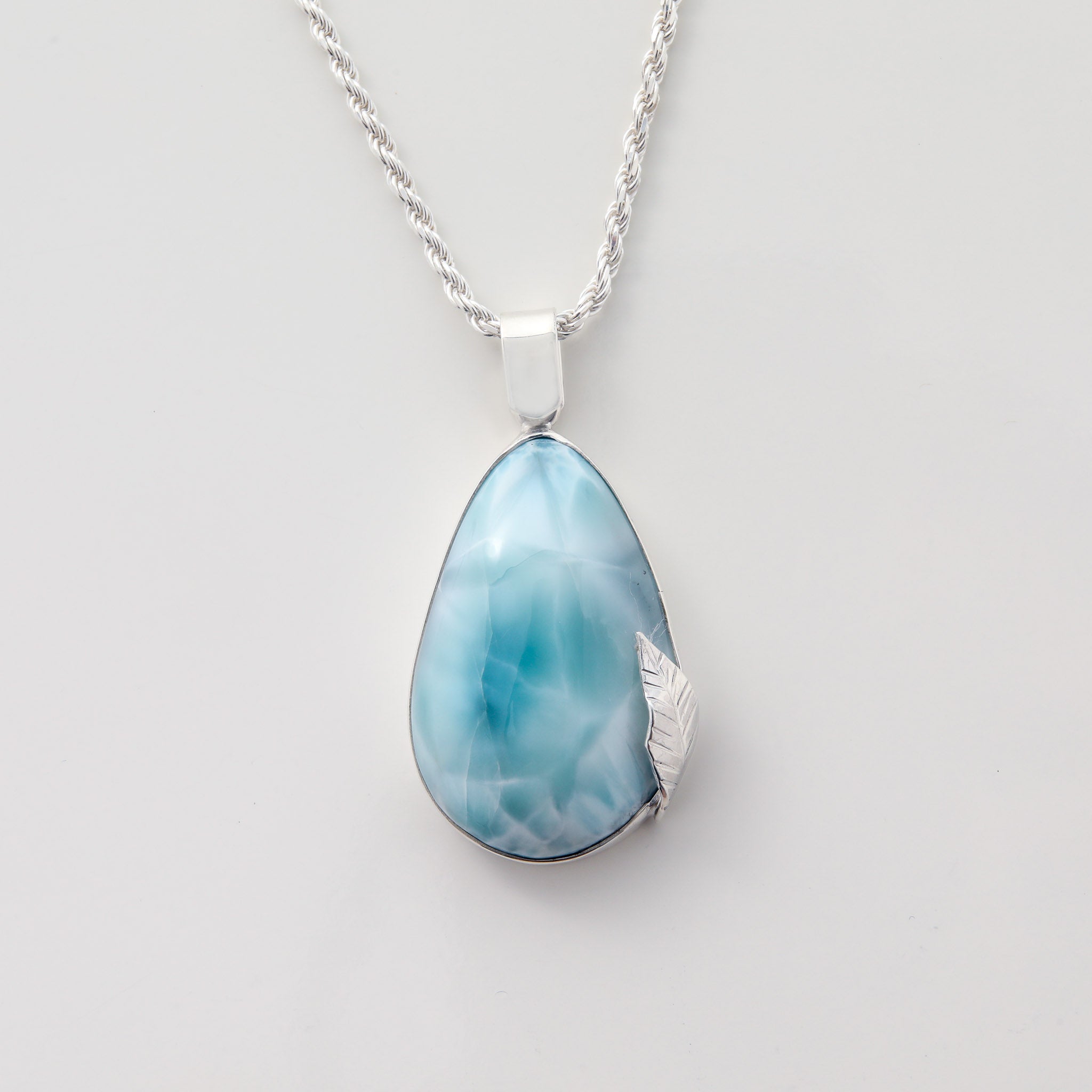 Larimar Pendant Verda showcases a stunning Larimar Stone with intricate silver leaf detailing