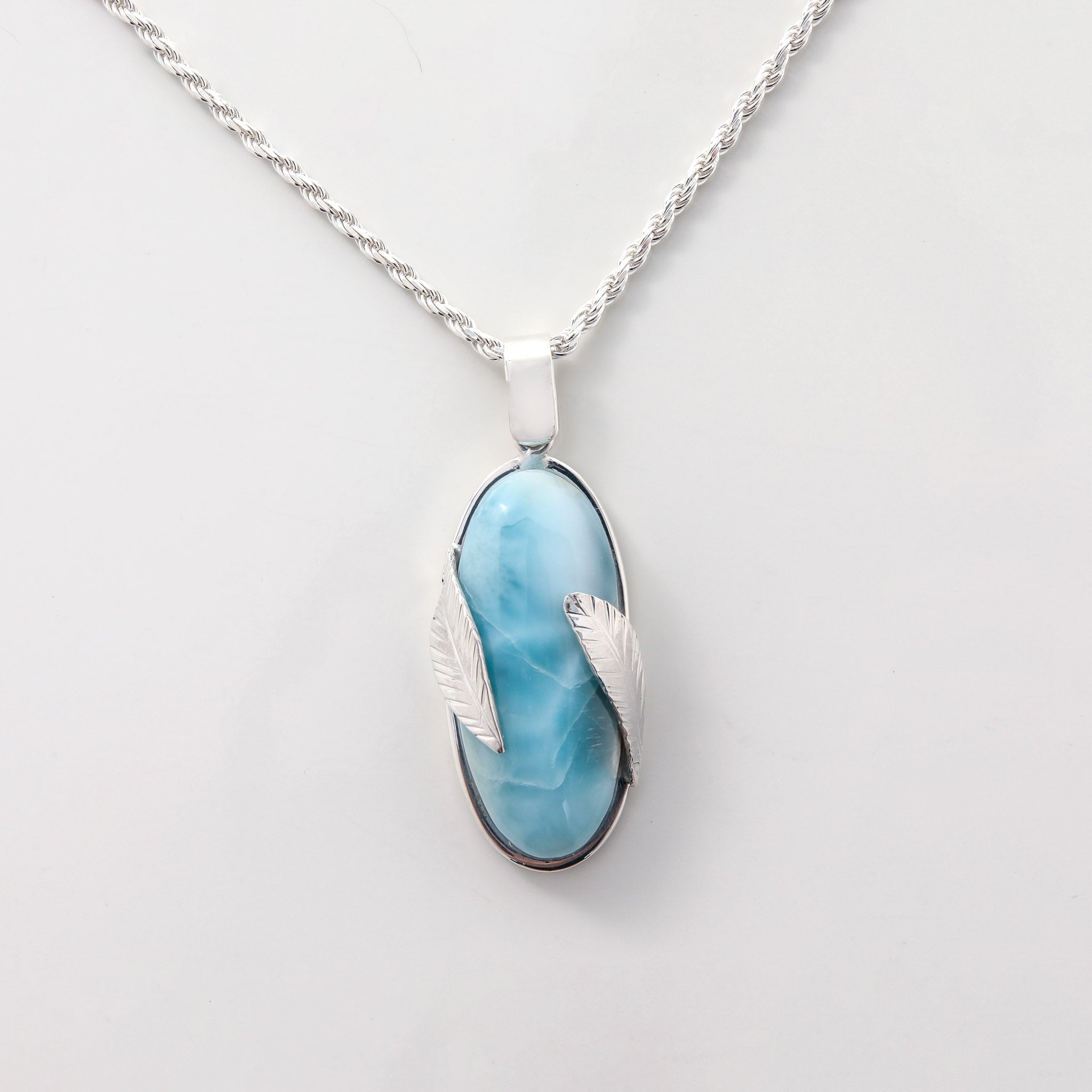 Larimar Pendant Lyra. Stylishly designed with silver leaf details