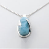 Larimar Pendant Lyra. Stylishly designed with silver leaf details