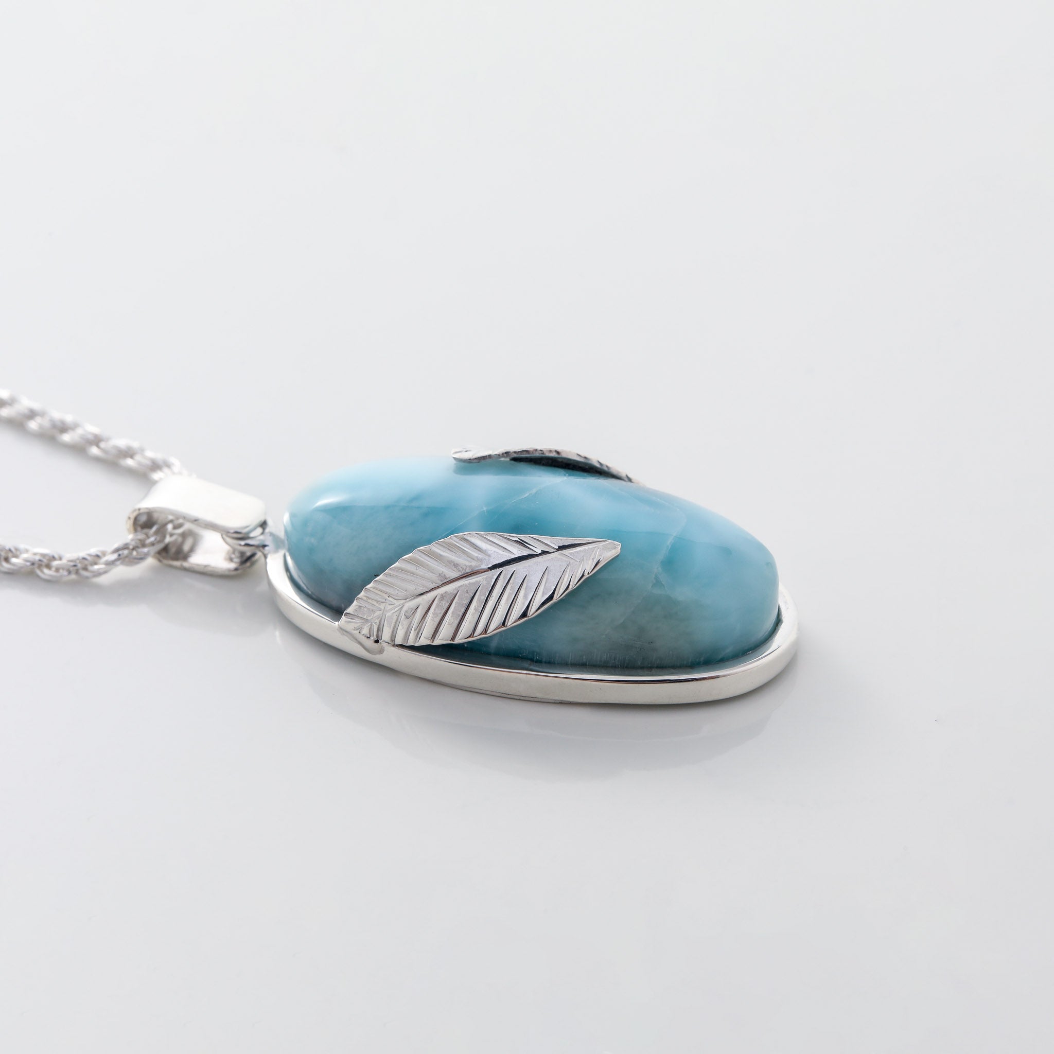 Larimar Pendant Lyra. Stylishly designed with silver leaf details