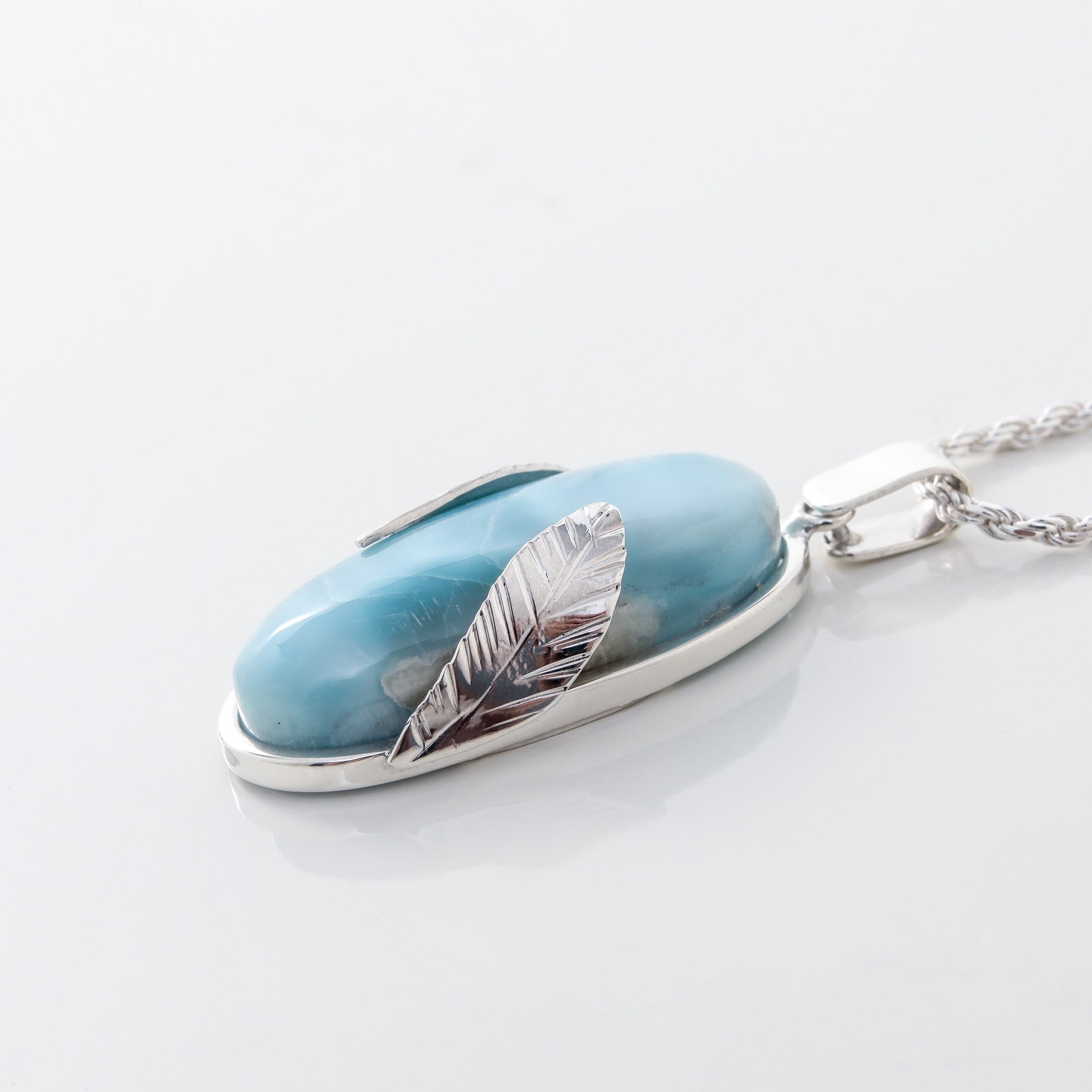 Larimar Pendant Lyra. Stylishly designed with silver leaf details