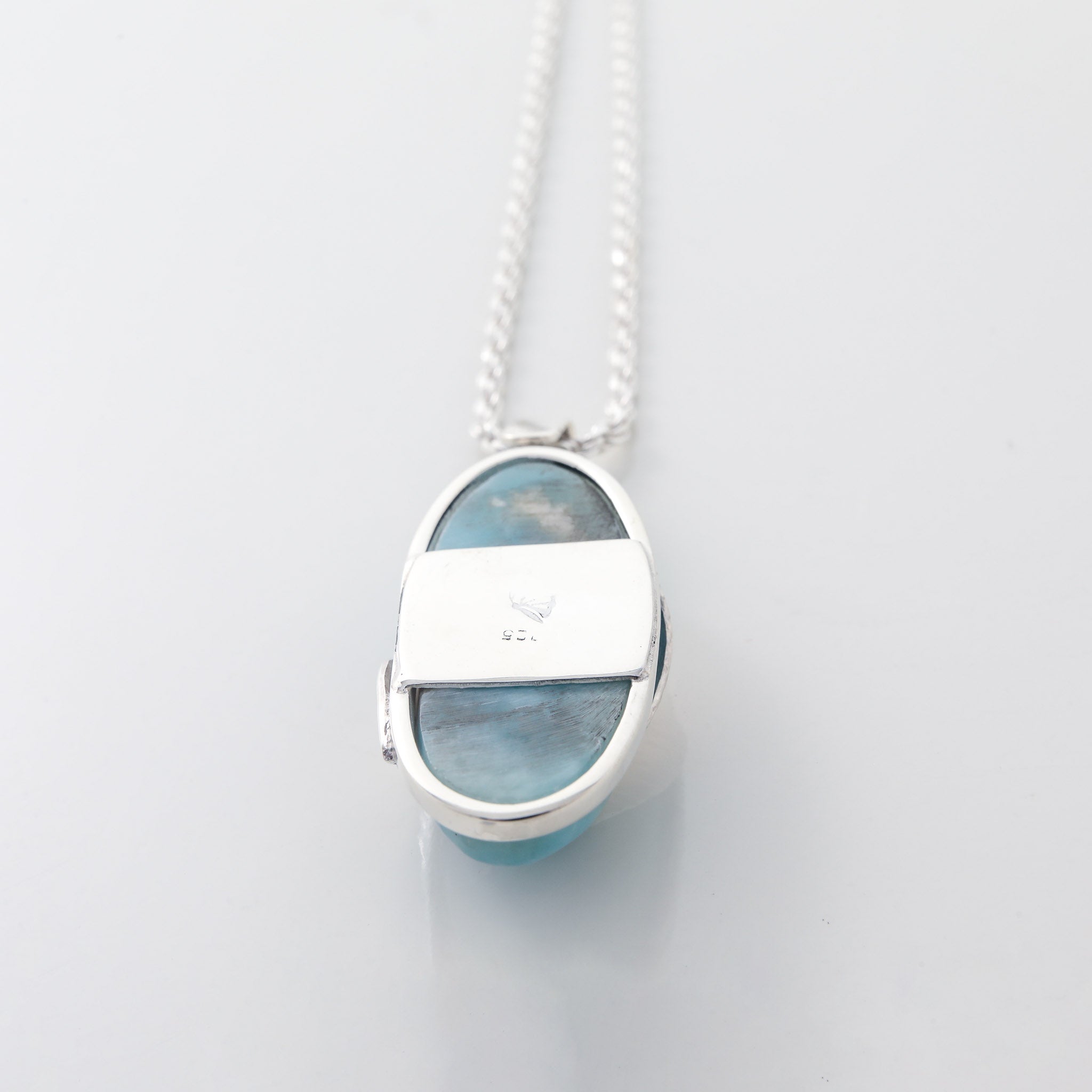 Larimar Pendant Lyra. Stylishly designed with silver leaf details