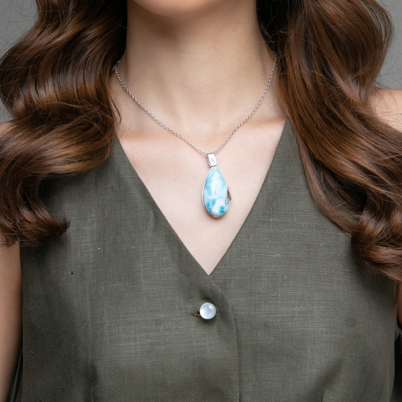 Larimar Pendant Flora complemented by a delicate silver leaf detail