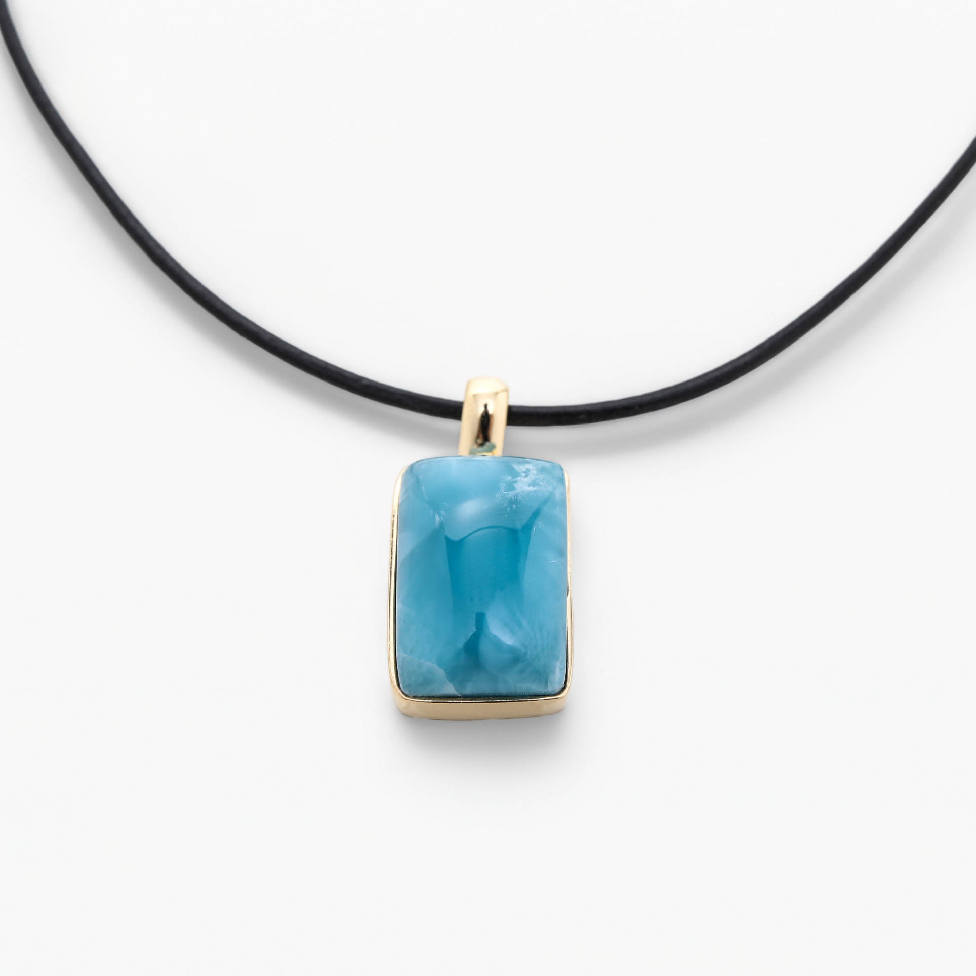 Larimar Necklace with a blue pendant on a white background