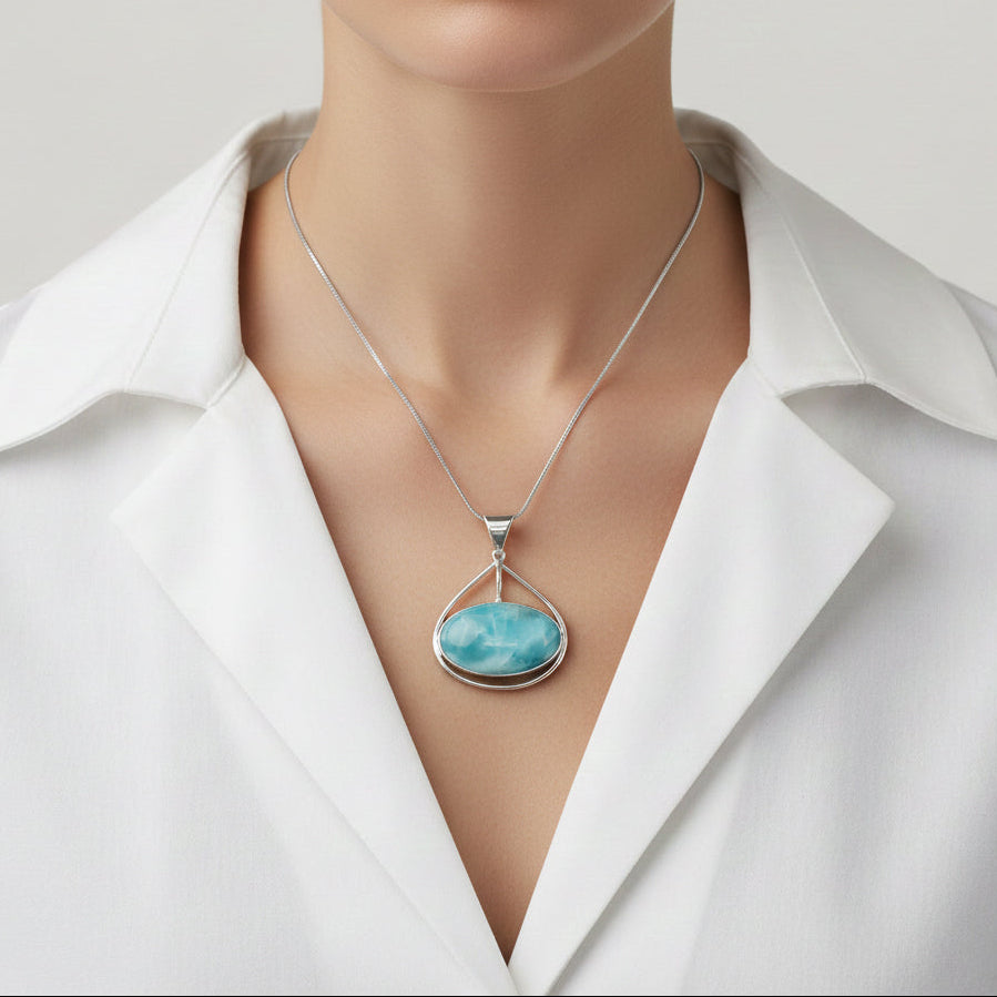 Larimar Pendant Willa pendant necklace on a white shirt against a neutral background