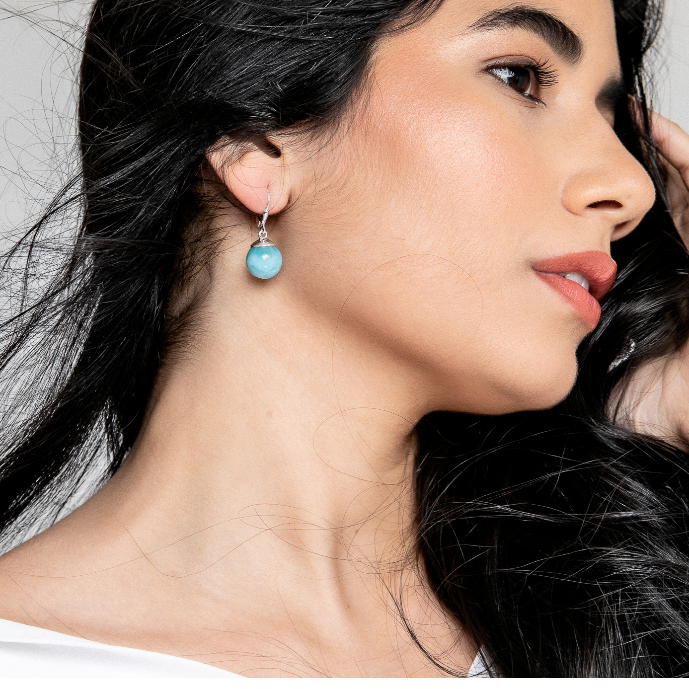 These larimar round bead dangle earrings are the perfect combination of beauty and functionality. The lightweight design makes them comfortable to wear all day long, while the stunning larimar stones add a touch of elegance and style.