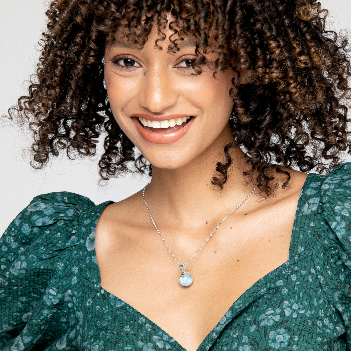 Refined taste deserves a match - Giulia Larimar bead pendant. Handcrafted in sterling silver, showcasing the natural beauty of the round Larimar stone. Perfect for any occasion, solo or layered. Elevate your style with the sophistication of Giulia pendant.